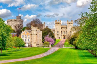 Windsor Castle: A magnificent royal residence with historic architecture and lush surroundings, located in Windsor, England.