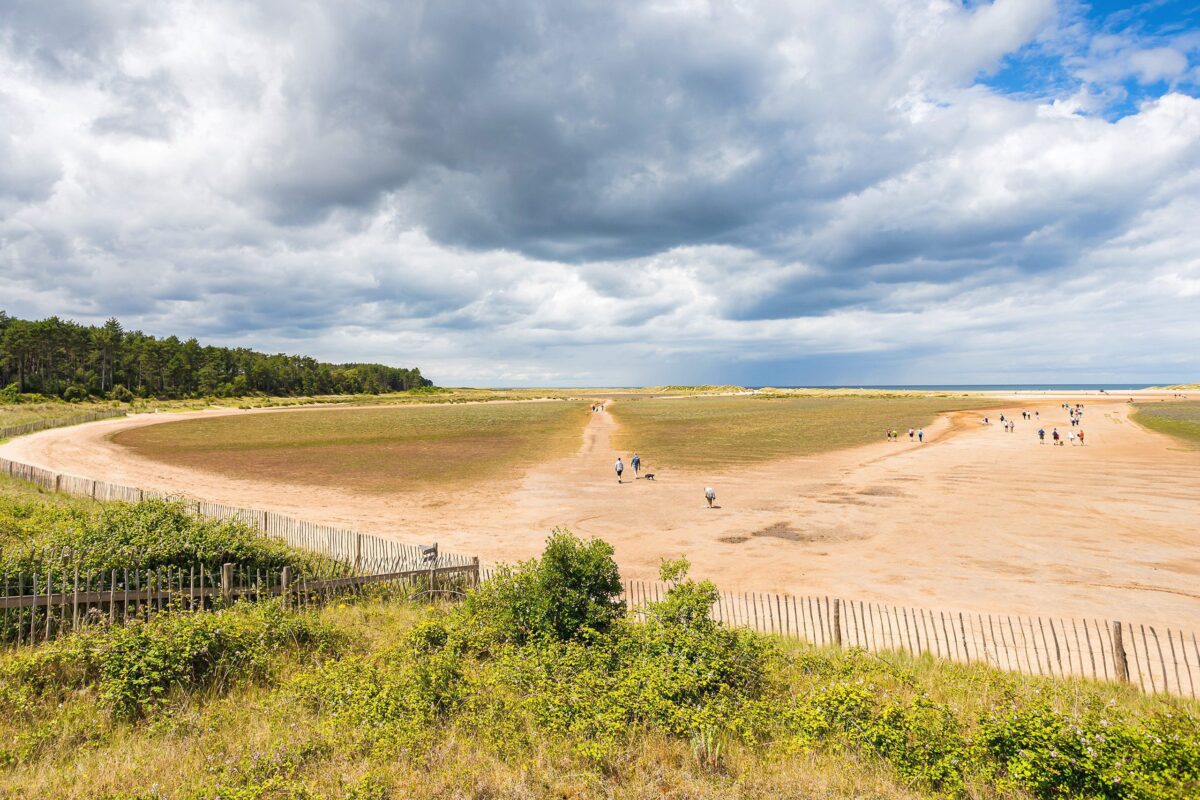 Holkham Beach: A pristine and expansive sandy beach with dunes and serene coastal beauty along the North Norfolk coast.
