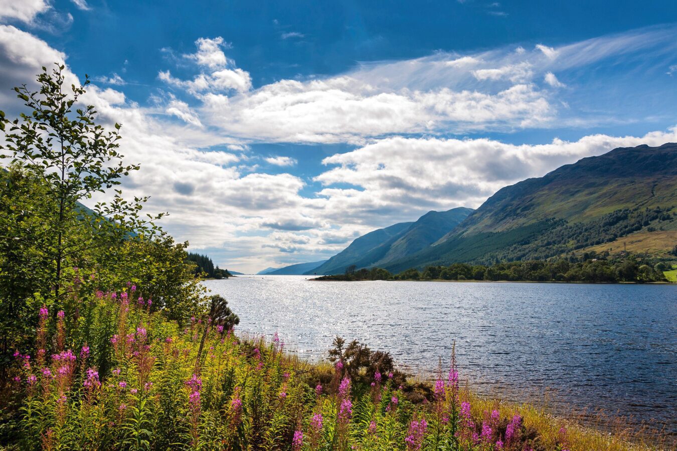 Loch Ness: A mesmerizing Scottish loch shrouded in mist, known for its mystique and legendary Loch Ness Monster.