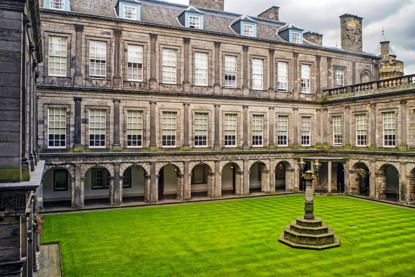 Palace of Holyroodhouse: A historic royal residence with magnificent architecture and scenic gardens in Edinburgh, Scotland.