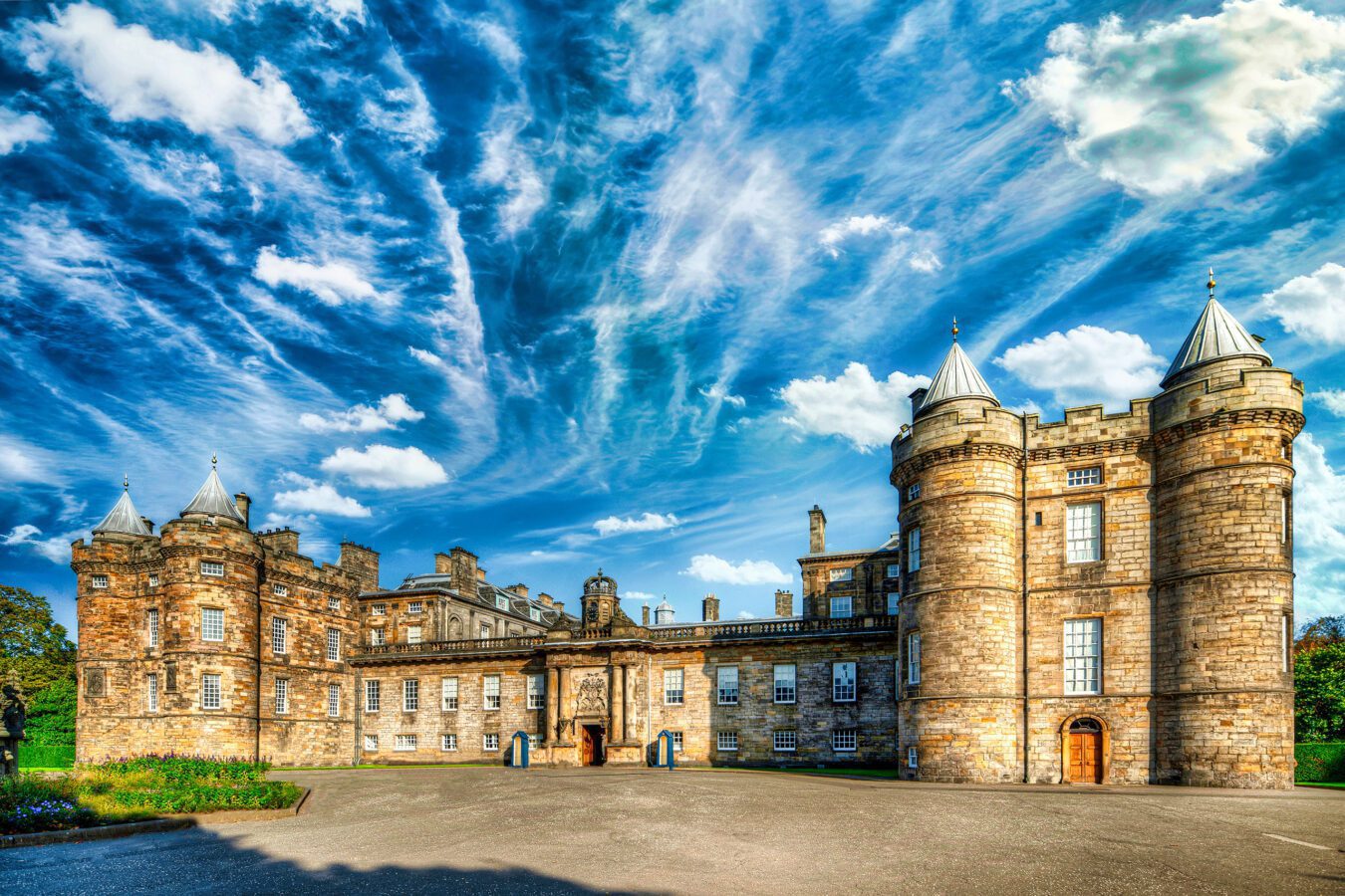 Palace of Holyroodhouse: A historic royal residence with magnificent architecture and scenic gardens in Edinburgh, Scotland.